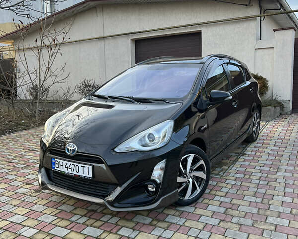 Чорний Тойота Aqua, об'ємом двигуна 1.5 л та пробігом 86 тис. км за 12700 $, фото 1 на Automoto.ua