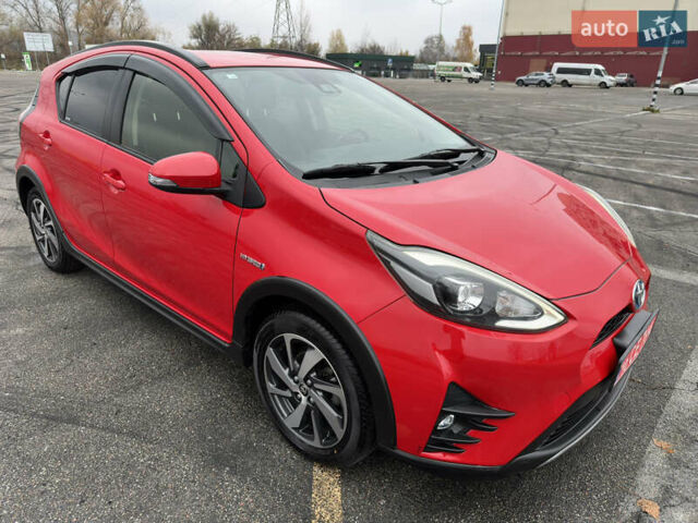 Красный Тойота Aqua, объемом двигателя 1.5 л и пробегом 79 тыс. км за 13700 $, фото 1 на Automoto.ua