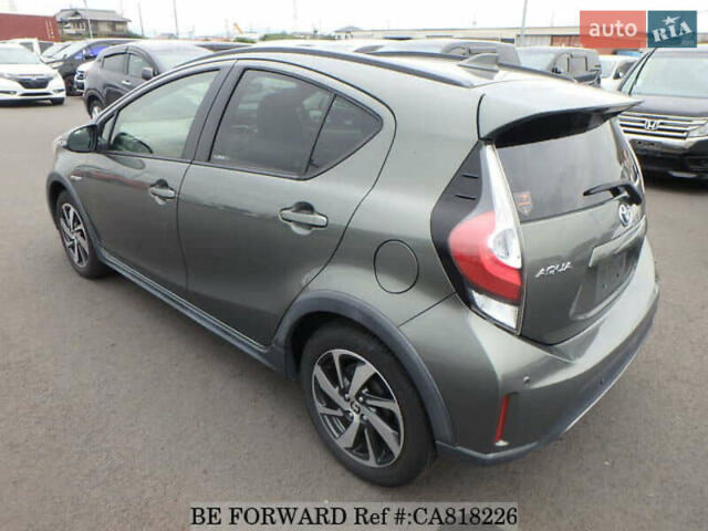 Зелений Тойота Aqua, об'ємом двигуна 1.5 л та пробігом 96 тис. км за 13500 $, фото 5 на Automoto.ua