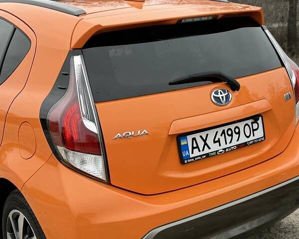 Оранжевый Тойота Aqua, объемом двигателя 1.5 л и пробегом 81 тыс. км за 11500 $, фото 6 на Automoto.ua