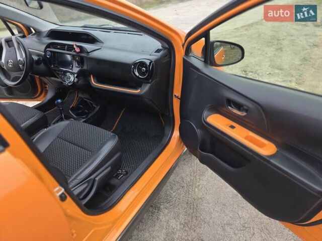 Оранжевый Тойота Aqua, объемом двигателя 1.5 л и пробегом 81 тыс. км за 11500 $, фото 18 на Automoto.ua