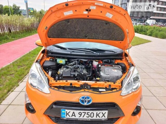 Оранжевый Тойота Aqua, объемом двигателя 1.5 л и пробегом 63 тыс. км за 10900 $, фото 32 на Automoto.ua