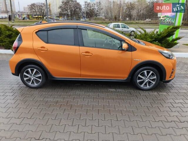 Оранжевый Тойота Aqua, объемом двигателя 1.5 л и пробегом 97 тыс. км за 13400 $, фото 2 на Automoto.ua