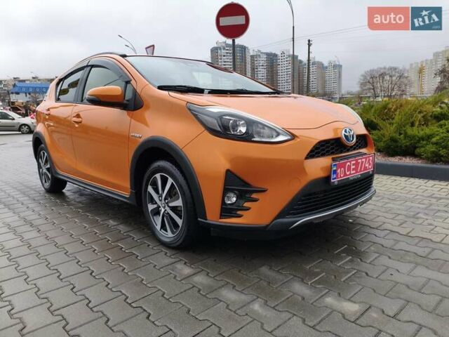 Оранжевый Тойота Aqua, объемом двигателя 1.5 л и пробегом 97 тыс. км за 13400 $, фото 1 на Automoto.ua