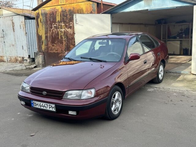 Красный Тойота Carina E, объемом двигателя 1.6 л и пробегом 259 тыс. км за 2800 $, фото 2 на Automoto.ua