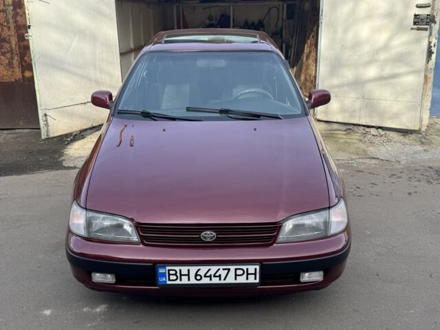 Красный Тойота Carina E, объемом двигателя 1.6 л и пробегом 259 тыс. км за 2800 $, фото 1 на Automoto.ua