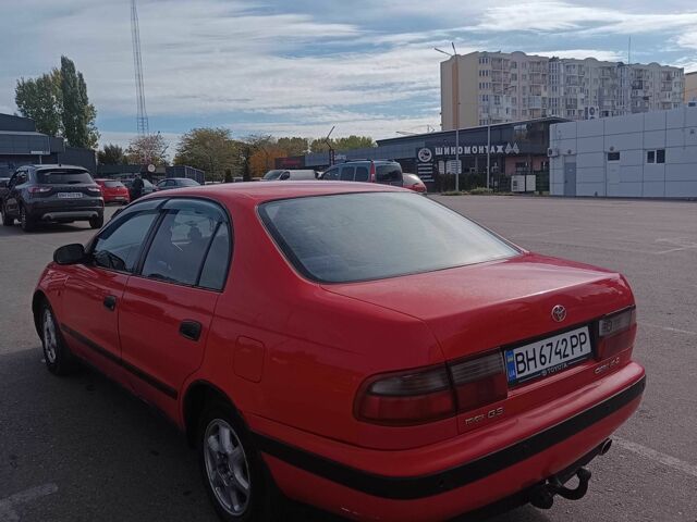 Червоний Тойота Carina E, об'ємом двигуна 2 л та пробігом 290 тис. км за 2300 $, фото 2 на Automoto.ua