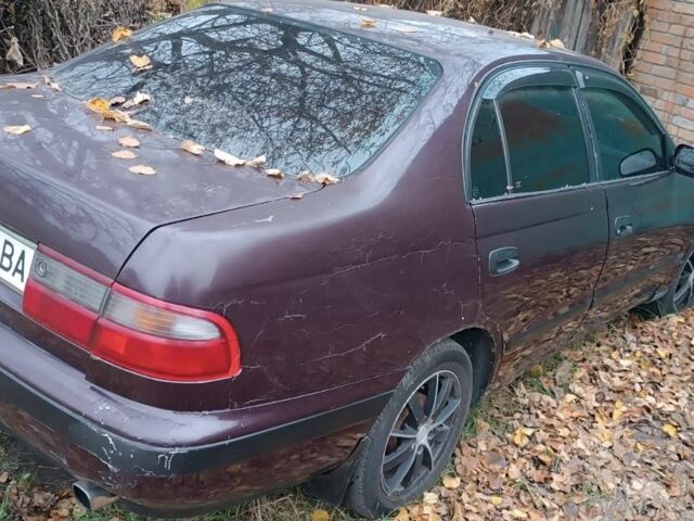 Червоний Тойота Carina E, об'ємом двигуна 1.6 л та пробігом 350 тис. км за 952 $, фото 8 на Automoto.ua