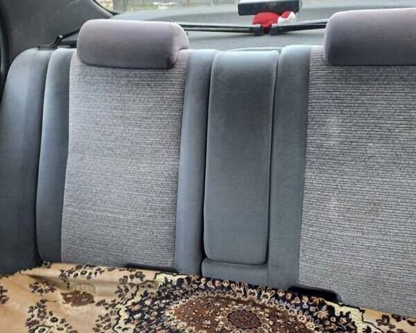 Красный Тойота Carina E, объемом двигателя 1.6 л и пробегом 450 тыс. км за 1150 $, фото 1 на Automoto.ua