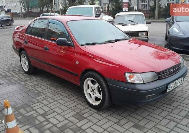 Червоний Тойота Carina E, об'ємом двигуна 1.6 л та пробігом 300 тис. км за 2670 $, фото 6 на Automoto.ua