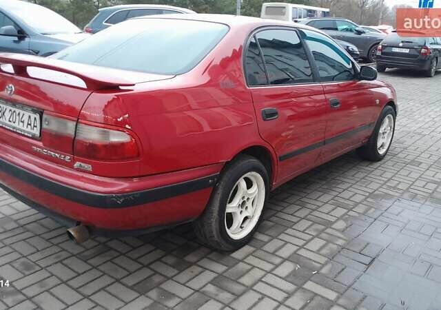 Червоний Тойота Carina E, об'ємом двигуна 1.6 л та пробігом 300 тис. км за 2670 $, фото 1 на Automoto.ua