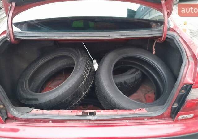 Червоний Тойота Carina E, об'ємом двигуна 1.6 л та пробігом 300 тис. км за 2670 $, фото 12 на Automoto.ua