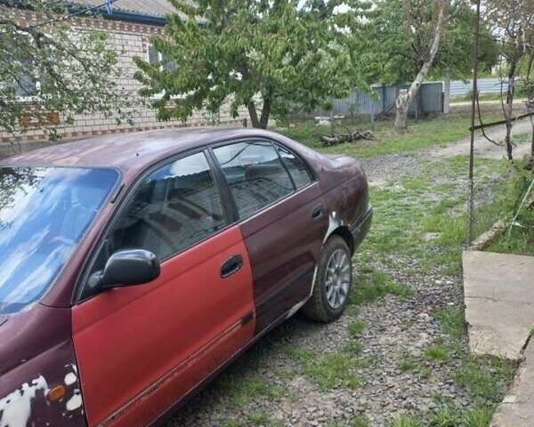 Красный Тойота Carina E, объемом двигателя 1.6 л и пробегом 450 тыс. км за 1150 $, фото 10 на Automoto.ua