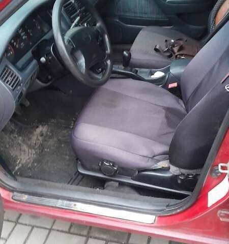 Червоний Тойота Carina E, об'ємом двигуна 1.6 л та пробігом 300 тис. км за 2670 $, фото 9 на Automoto.ua