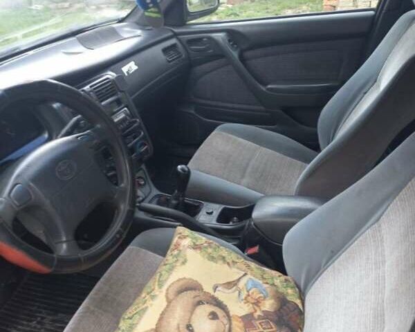 Красный Тойота Carina E, объемом двигателя 1.6 л и пробегом 450 тыс. км за 1150 $, фото 3 на Automoto.ua