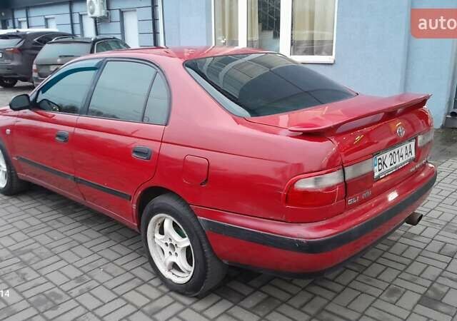 Червоний Тойота Carina E, об'ємом двигуна 1.6 л та пробігом 300 тис. км за 2670 $, фото 13 на Automoto.ua