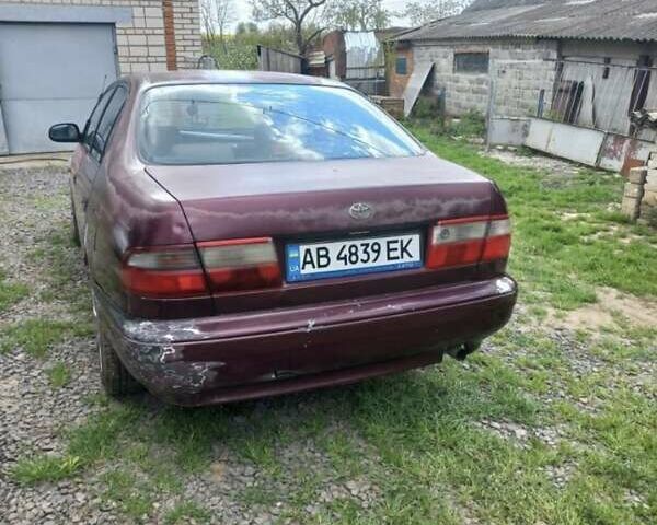 Красный Тойота Carina E, объемом двигателя 1.6 л и пробегом 450 тыс. км за 1150 $, фото 6 на Automoto.ua