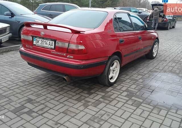 Червоний Тойота Carina E, об'ємом двигуна 1.6 л та пробігом 300 тис. км за 2670 $, фото 7 на Automoto.ua