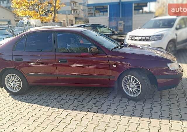 Червоний Тойота Carina E, об'ємом двигуна 2 л та пробігом 260 тис. км за 4500 $, фото 1 на Automoto.ua