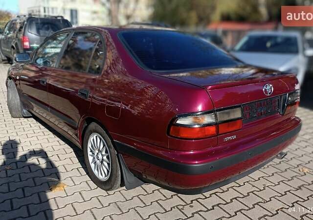 Червоний Тойота Carina E, об'ємом двигуна 2 л та пробігом 260 тис. км за 4500 $, фото 9 на Automoto.ua