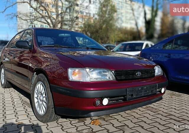 Червоний Тойота Carina E, об'ємом двигуна 2 л та пробігом 260 тис. км за 4500 $, фото 4 на Automoto.ua