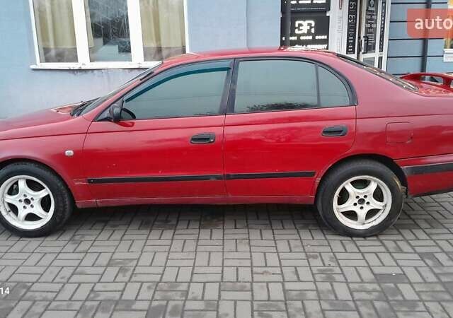 Червоний Тойота Carina E, об'ємом двигуна 1.6 л та пробігом 300 тис. км за 2670 $, фото 4 на Automoto.ua