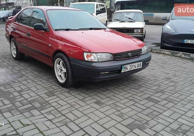 Червоний Тойота Carina E, об'ємом двигуна 1.6 л та пробігом 300 тис. км за 2670 $, фото 3 на Automoto.ua