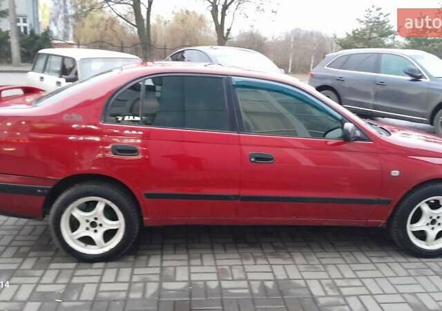 Червоний Тойота Carina E, об'ємом двигуна 1.6 л та пробігом 300 тис. км за 2670 $, фото 8 на Automoto.ua