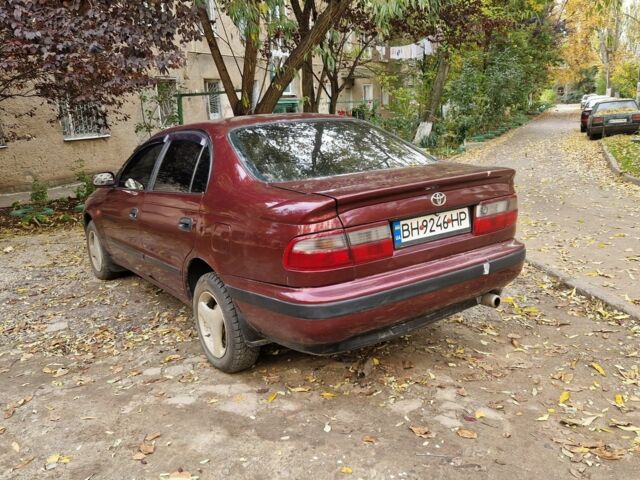 Червоний Тойота Carina E, об'ємом двигуна 1.6 л та пробігом 220 тис. км за 1500 $, фото 7 на Automoto.ua