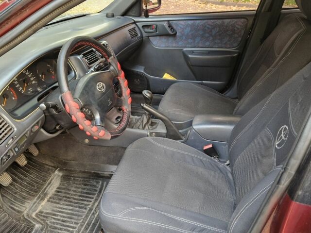 Червоний Тойота Carina E, об'ємом двигуна 1.6 л та пробігом 220 тис. км за 1500 $, фото 9 на Automoto.ua