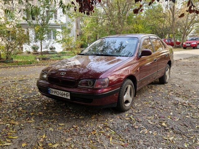Червоний Тойота Carina E, об'ємом двигуна 1.6 л та пробігом 220 тис. км за 1500 $, фото 1 на Automoto.ua