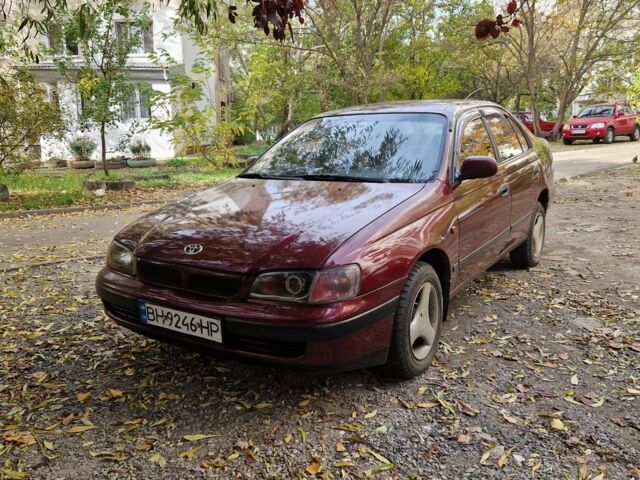 Червоний Тойота Carina E, об'ємом двигуна 1.6 л та пробігом 220 тис. км за 1500 $, фото 4 на Automoto.ua