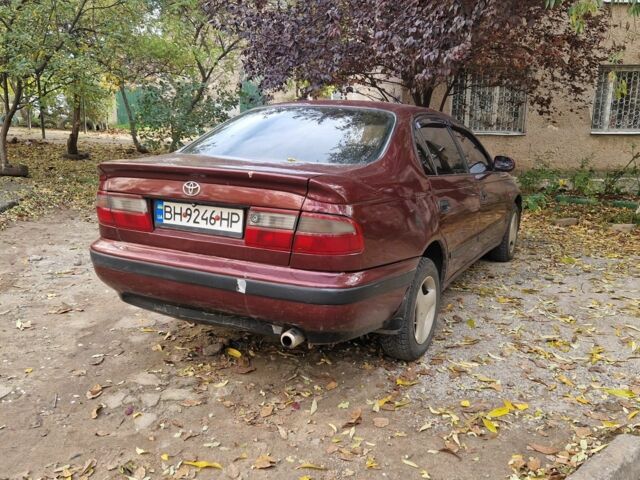 Червоний Тойота Carina E, об'ємом двигуна 1.6 л та пробігом 220 тис. км за 1500 $, фото 2 на Automoto.ua