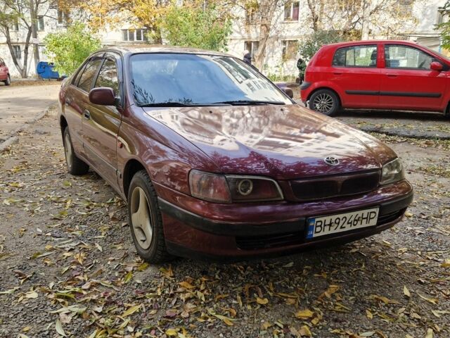 Червоний Тойота Carina E, об'ємом двигуна 1.6 л та пробігом 220 тис. км за 1500 $, фото 5 на Automoto.ua