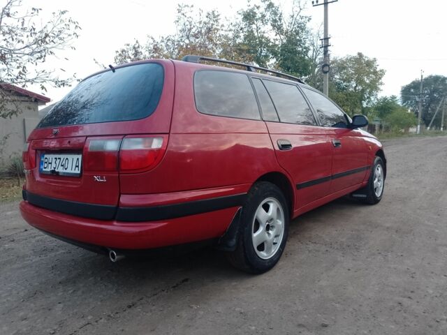 Червоний Тойота Carina E, об'ємом двигуна 1.6 л та пробігом 111 тис. км за 2000 $, фото 4 на Automoto.ua