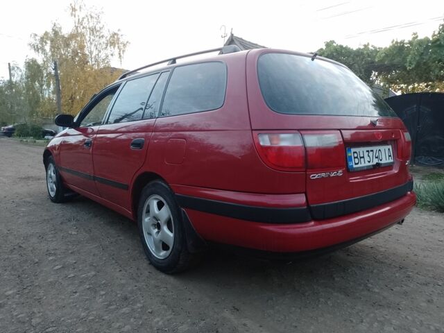 Червоний Тойота Carina E, об'ємом двигуна 1.6 л та пробігом 111 тис. км за 2000 $, фото 3 на Automoto.ua