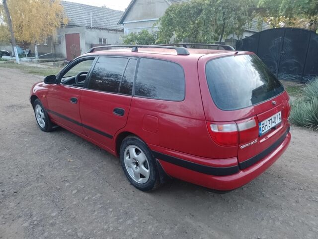 Червоний Тойота Carina E, об'ємом двигуна 1.6 л та пробігом 111 тис. км за 2000 $, фото 5 на Automoto.ua