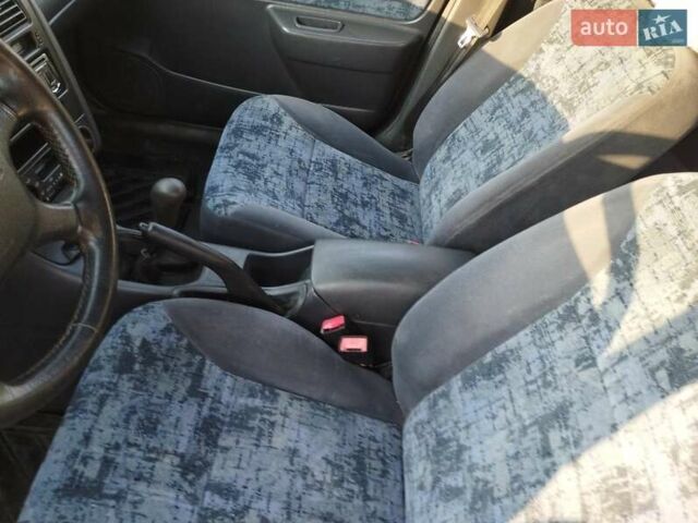 Красный Тойота Carina E, объемом двигателя 2 л и пробегом 450 тыс. км за 3700 $, фото 12 на Automoto.ua