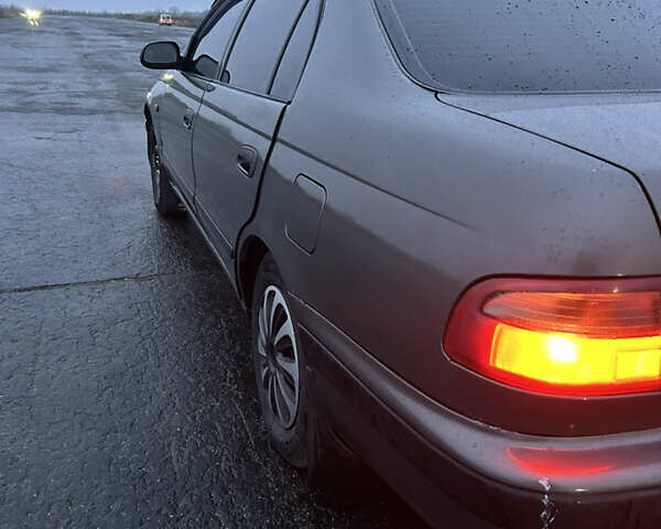 Сірий Тойота Carina E, об'ємом двигуна 2 л та пробігом 450 тис. км за 3000 $, фото 6 на Automoto.ua