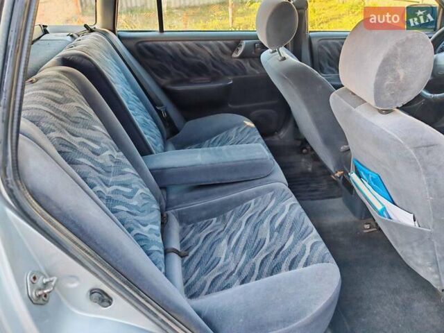 Сірий Тойота Carina E, об'ємом двигуна 1.8 л та пробігом 256 тис. км за 2850 $, фото 12 на Automoto.ua