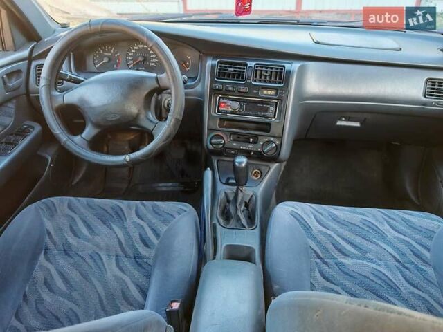 Сірий Тойота Carina E, об'ємом двигуна 1.8 л та пробігом 256 тис. км за 2850 $, фото 11 на Automoto.ua