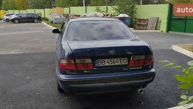 Синій Тойота Carina E, об'ємом двигуна 2 л та пробігом 397 тис. км за 4750 $, фото 5 на Automoto.ua