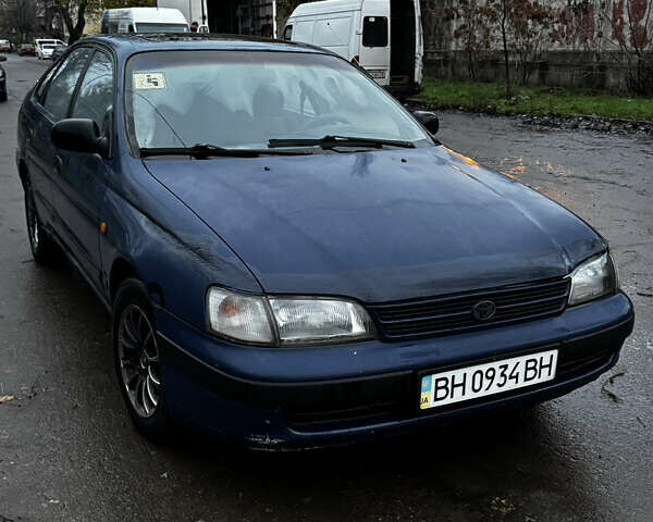 Синій Тойота Carina E, об'ємом двигуна 2 л та пробігом 188 тис. км за 1750 $, фото 3 на Automoto.ua