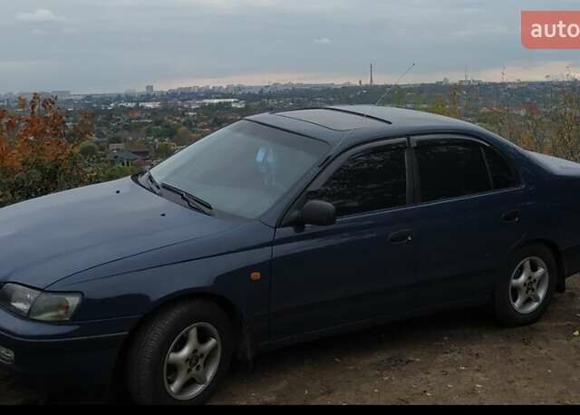 Синій Тойота Carina E, об'ємом двигуна 2 л та пробігом 397 тис. км за 4750 $, фото 3 на Automoto.ua