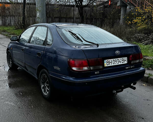 Синій Тойота Carina E, об'ємом двигуна 2 л та пробігом 188 тис. км за 1750 $, фото 7 на Automoto.ua