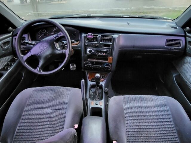 Синій Тойота Carina E, об'ємом двигуна 1.8 л та пробігом 290 тис. км за 1650 $, фото 10 на Automoto.ua