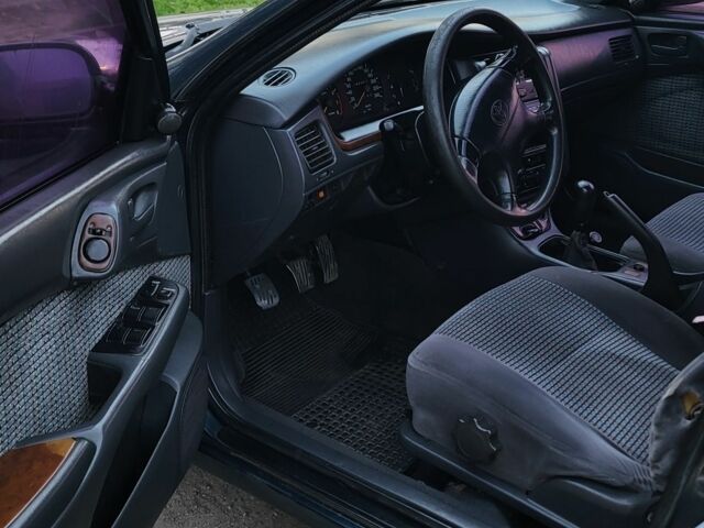 Синій Тойота Carina E, об'ємом двигуна 1.8 л та пробігом 290 тис. км за 1650 $, фото 9 на Automoto.ua