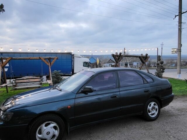 Синій Тойота Carina E, об'ємом двигуна 1.8 л та пробігом 290 тис. км за 1650 $, фото 3 на Automoto.ua