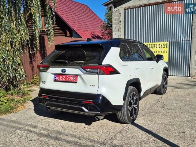 Белый Тойота RAV4 PHEV, объемом двигателя 2.49 л и пробегом 90 тыс. км за 42000 $, фото 4 на Automoto.ua