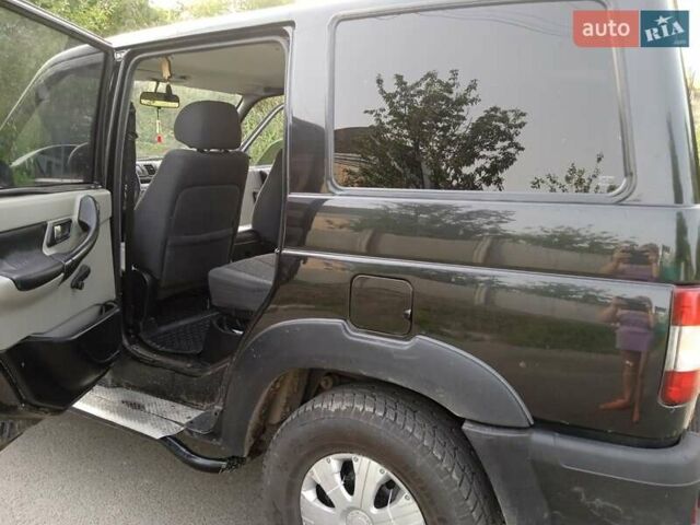 Черный УАЗ 3163 Patriot, объемом двигателя 2.7 л и пробегом 297 тыс. км за 6600 $, фото 7 на Automoto.ua